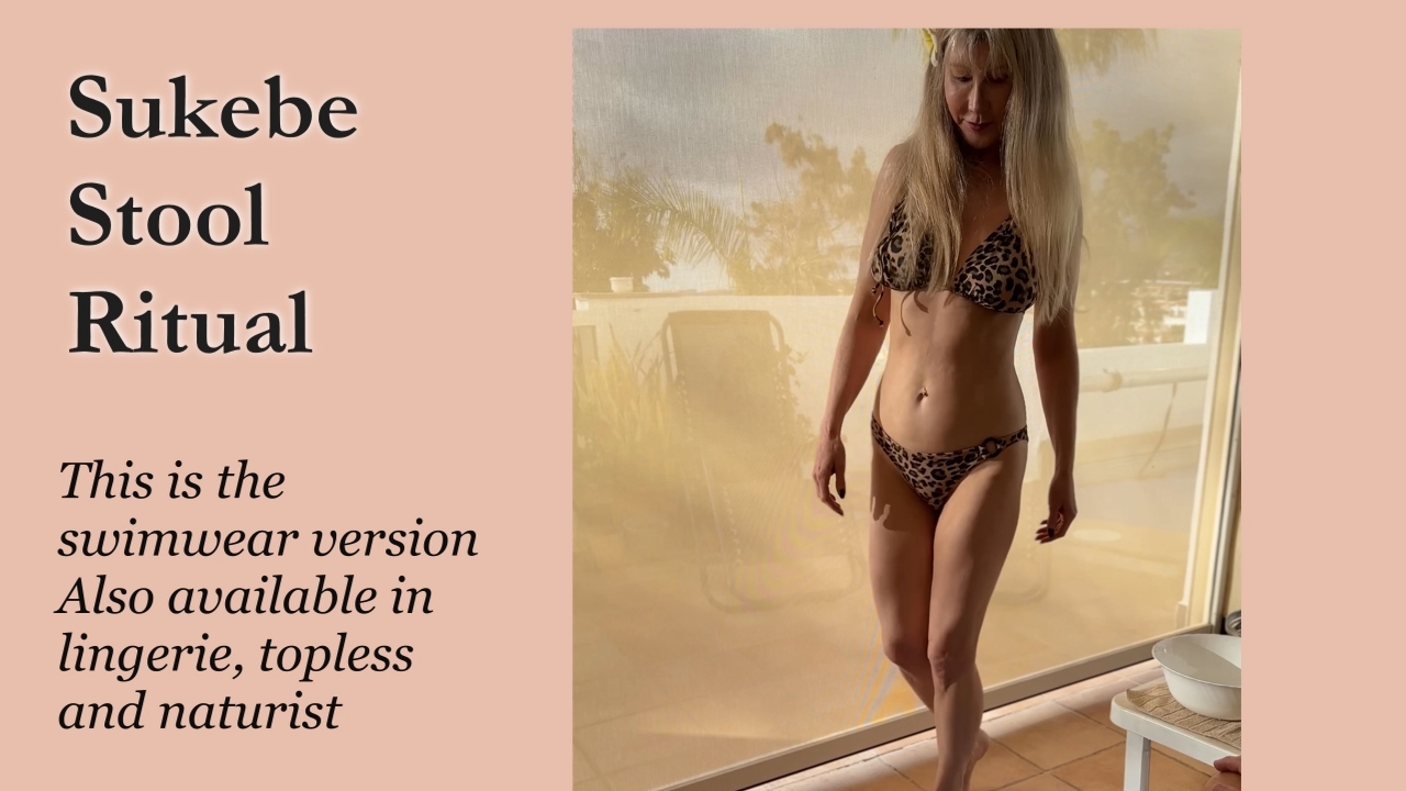 Francesca, totally nude kneels in front of her client as she washes his cock and balls